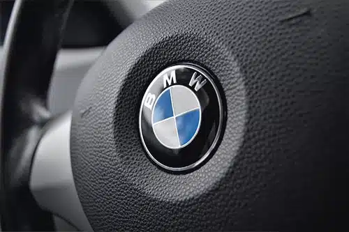 Quality Import Service giving 3 fall maintenance tips for BMW cars and showing the BMW logo