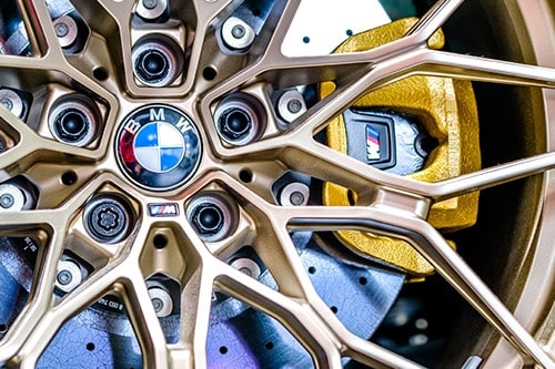 Close-up view of BMW Firm and the brake disc | Quality Import Services