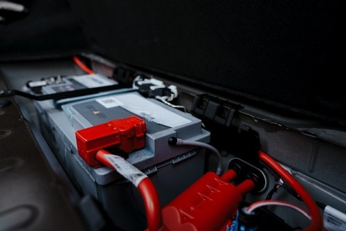 European Car Winter Preparation | Battery Checks at Quality Import Service. Closeup image of luxury car battery.